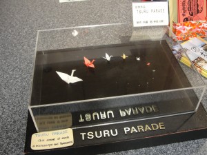 The smallest crane is just a dot to the eye and was made with tweezers under a microscope.