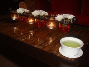 tea and centerpiece with flowers and candles at let's relax spa in phuket thailand