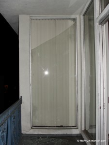 a floor-to-ceiling glass panel broken in the explosion