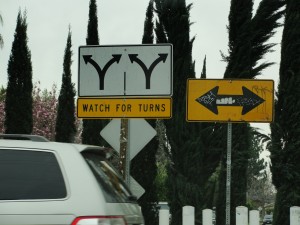 sign advising caution on turns
