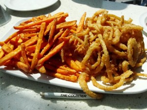 sweet potato fries and onion strings at the counter