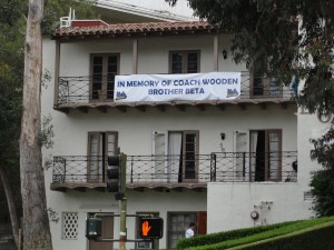 beta house with sign in memory of john wooden, a fellow brother