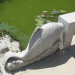 stone fish carved into bridge decoration