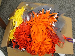bright clumps of yellow, red, and orange lanyards