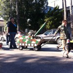 dog dressed as tank operator in tank float for haute dog parade 2010