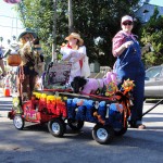 dogs dressed as farmville animals on farmville float for haute dog parade 2010
