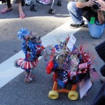 dog dressed as patriotic cheerleader pushing tribute to our soldiers float for haute dog parade 2010