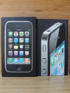 front view of iphone 3gs and iphone 4 boxes with images of the phones