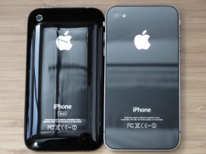back view of iphone 3gs and iphone 4 with apple logo and phone info