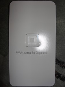 paper with "welcome to square" printed on it and square device attached
