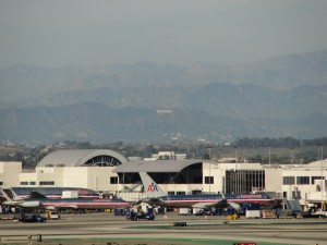 hollywood sign seen in the distance behind lax