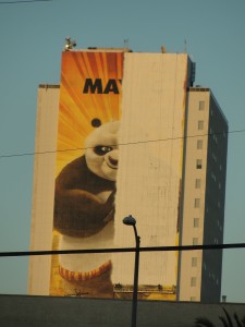 billboard for kung fu panda movie painted on the wall of a building