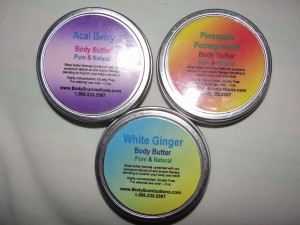 three canisters of body scentsations body butter