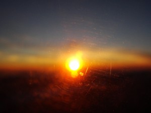 blurry view of sunset from plane window
