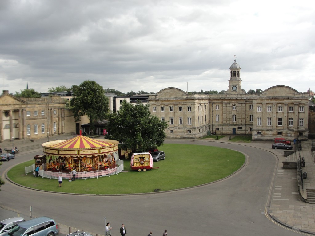 view of merry-go-round and york castle museum from clifford's tower