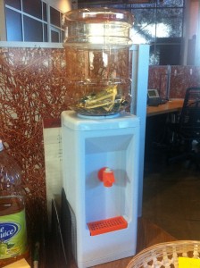 mini water cooler for desktop use repurposed as piggy bank