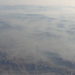 view of mountains through thick fog