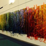 large piece of art by artist james dupree on display at portland aiport