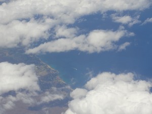 first view of city on hawaiian island molokai from plane