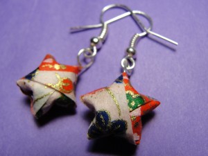 close-up picture of simple origami star earrings