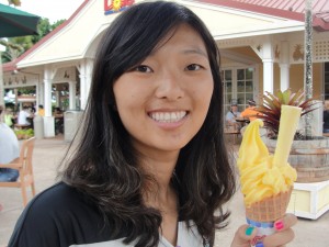 holding a pineapple-flavored ice cream cone at the dole plantation in hawaii