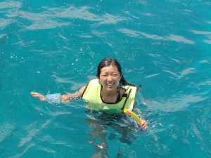 floating in ocean with vest and waterproof camera
