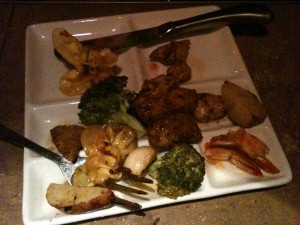 pieces of meat and vegetables left over from meal at the melting pot