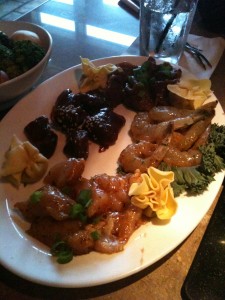 platter of raw chicken, pork, shrimp, beef, and mushroom wontons at the melting pot
