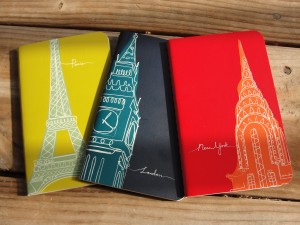 set of three travel-themed notebooks with Paris, New York, and London imagery