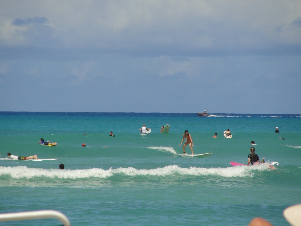 surfing small wave at waikiki beach