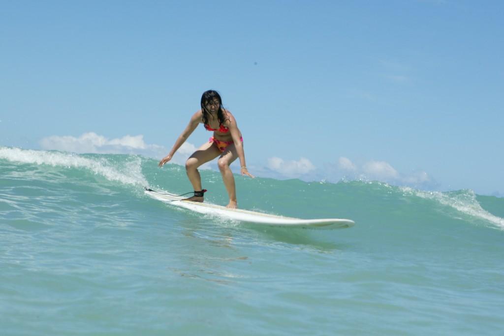 surfing with knees bent for better control