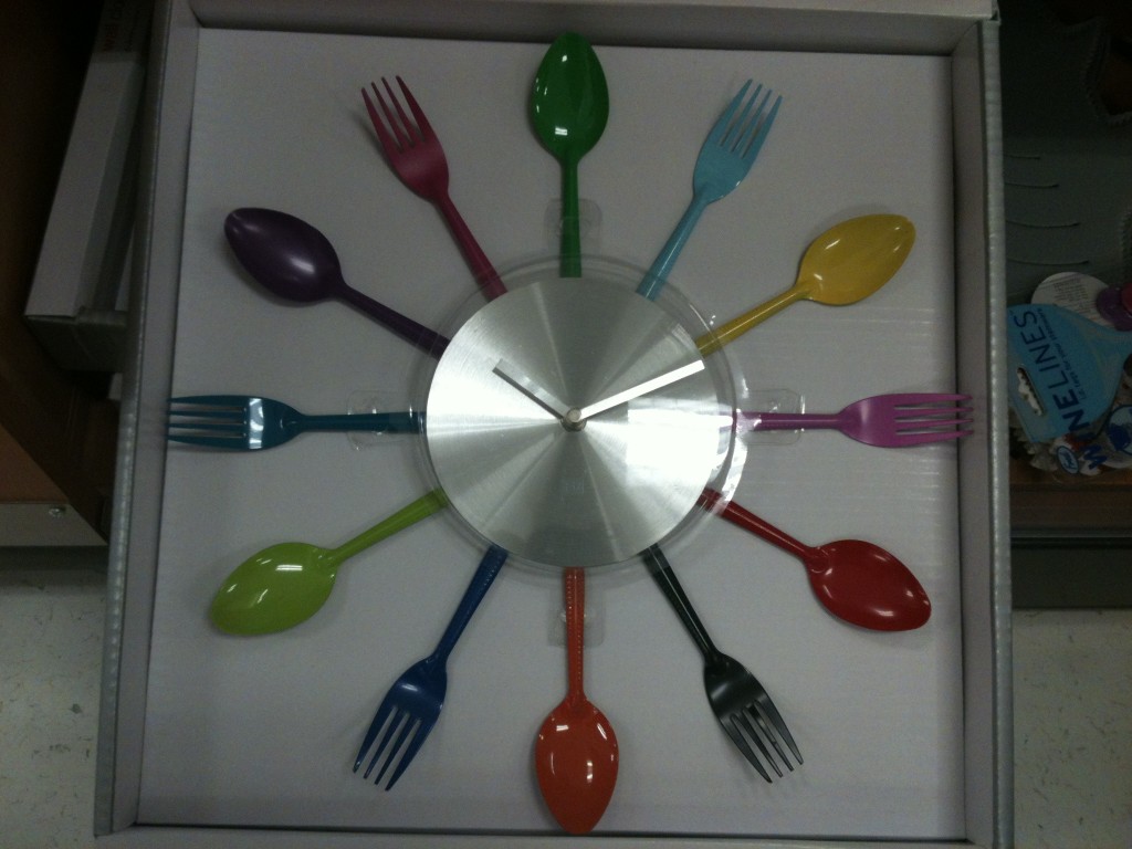 clock with colorful spoons and forks indicating each hour