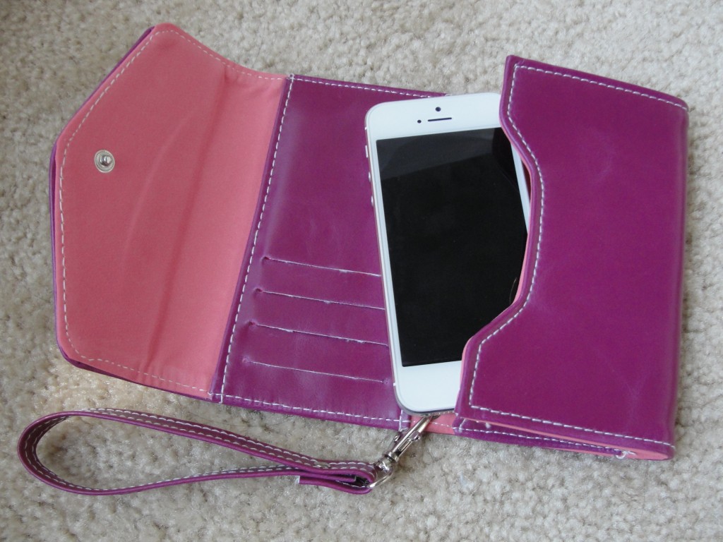 white & silver iphone 5 in purple and pink clutch wallet