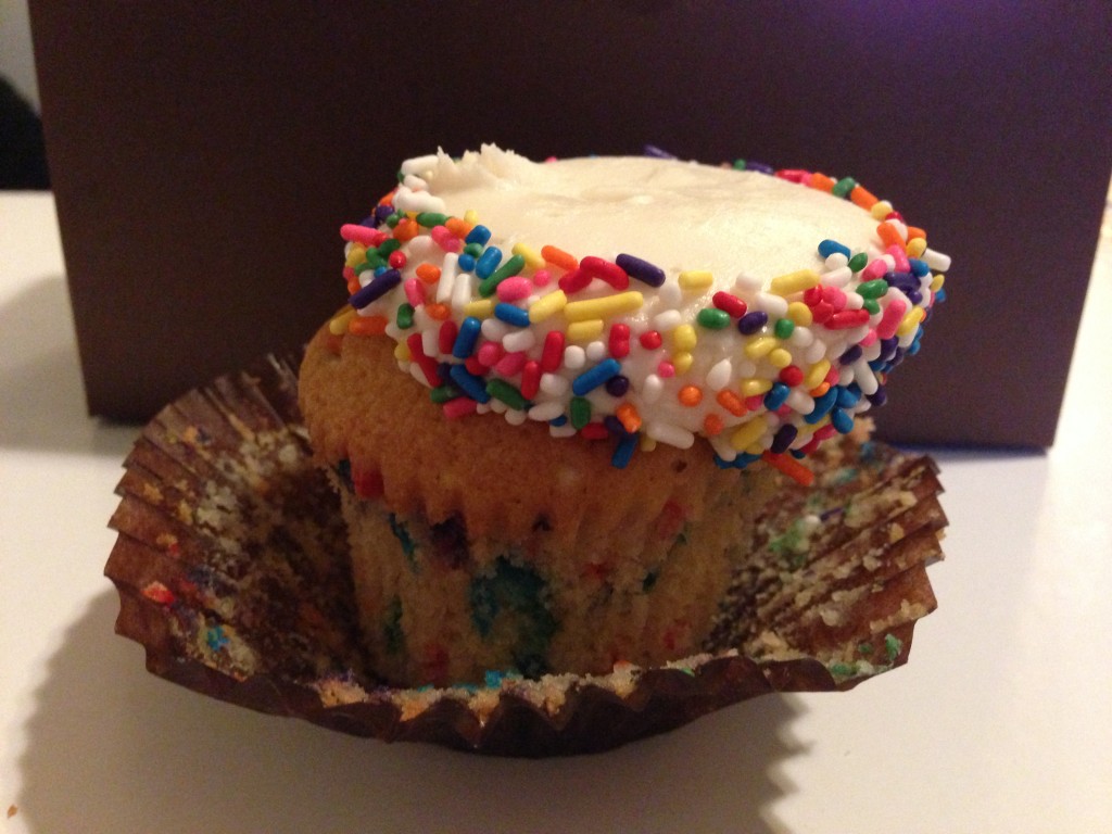 side view of magic mountain confetti cupcake with sprinkles from bake you happy in valencia