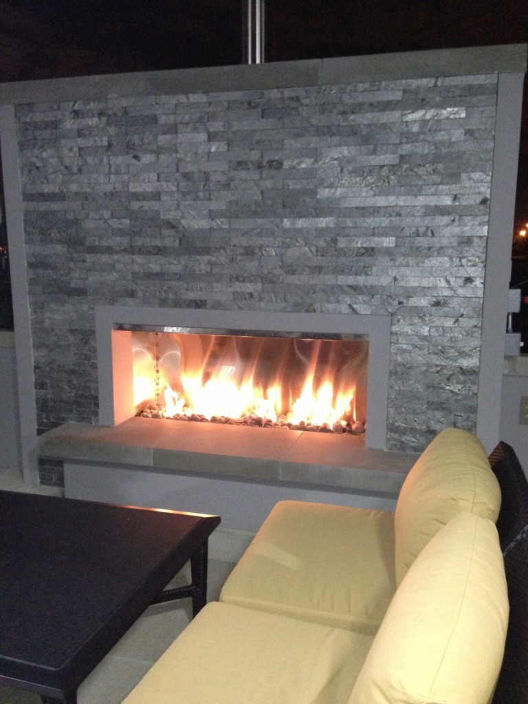 outdoor fireplace with couch seating at hyatt place