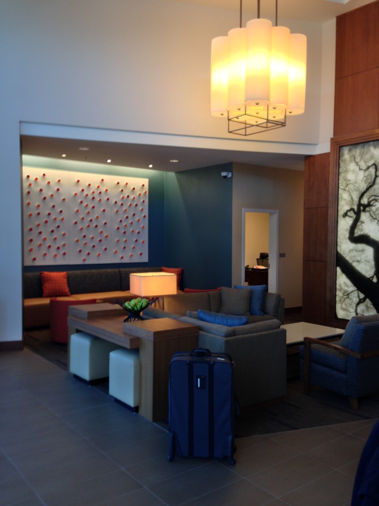 lobby of hyatt place with couches and artwork