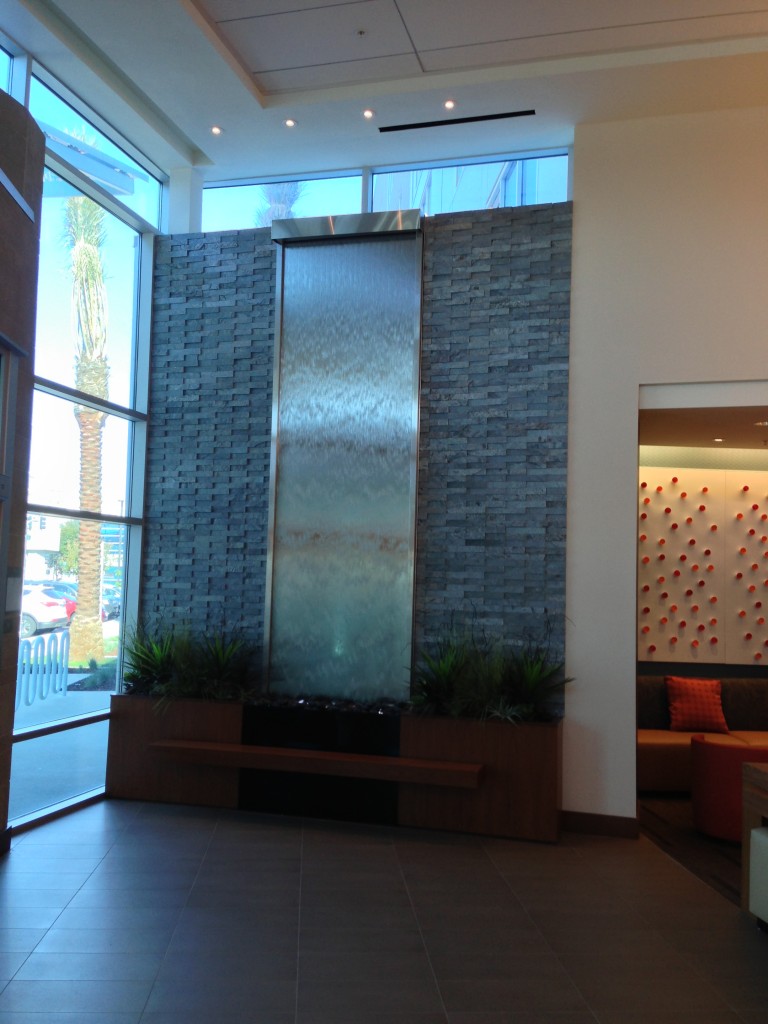 large water wall decoration at entrance of hyatt place
