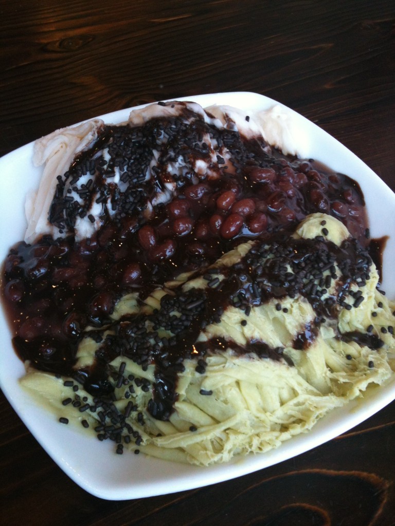 strawberry and green tea snow cream with red beans, chocolate sauce, and chocolate sprinkles from blockheads shavery