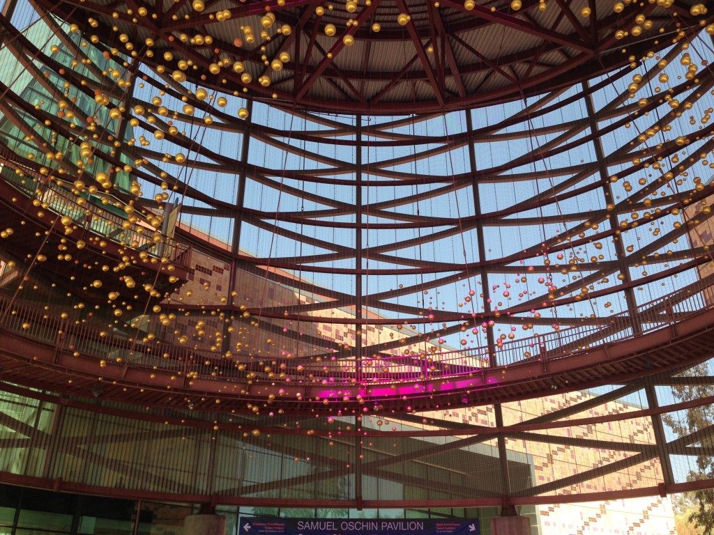 california science center entrance with golden globes hanging from ceiling