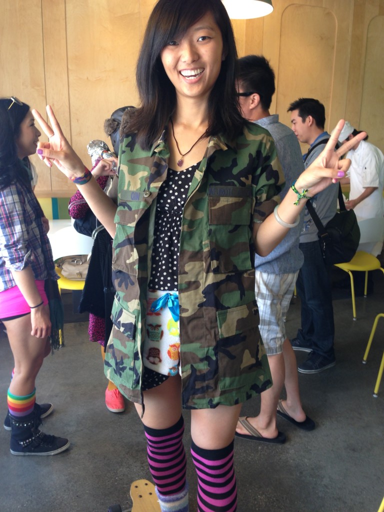 girl dressed in odd assortment of thrift shop style clothing