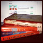 stack of books and coursera website representing knowledge