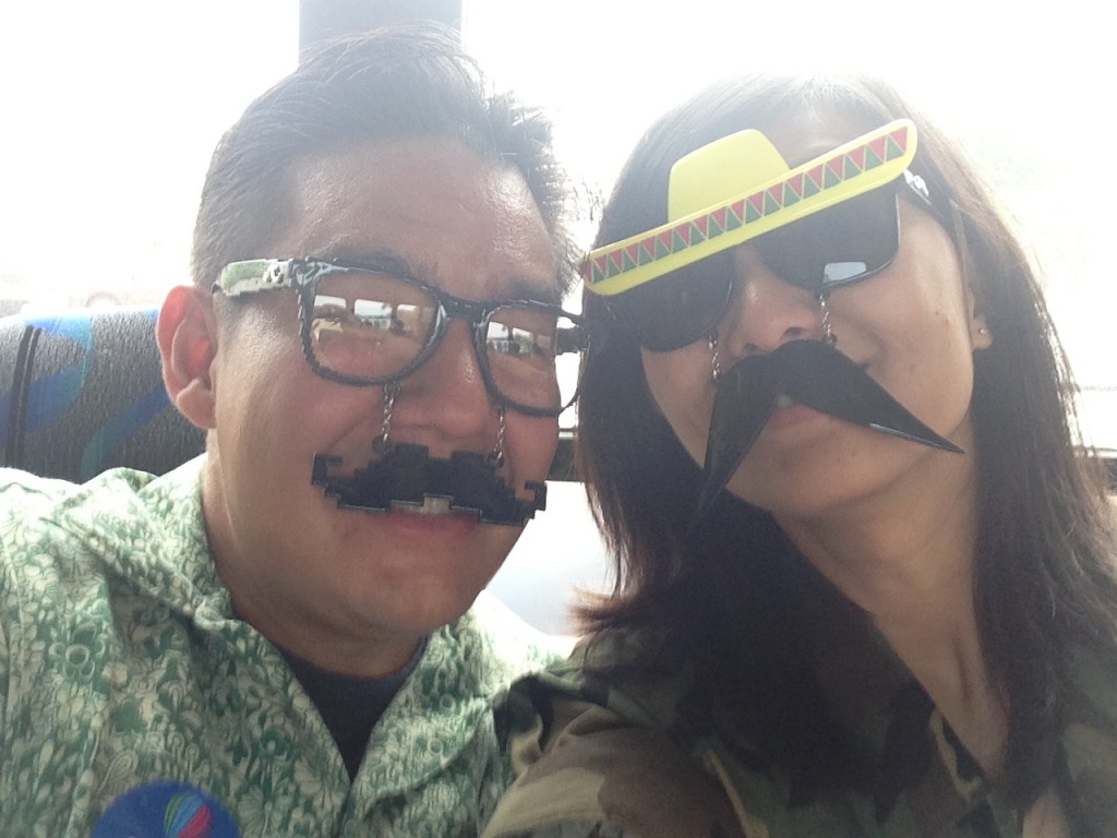 two people wearing sunglasses with moustaches
