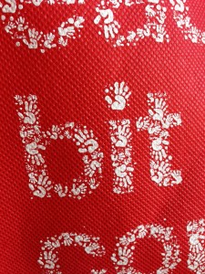 target bit tote small reusable bag with words made of tiny handprints