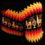 bright yellow, orange, and red pattern on black sweater