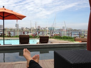 lounging by pool in cabana with view of harbor