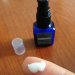 naturopathica rosemary oil-reducing moisturizer swatch on finger