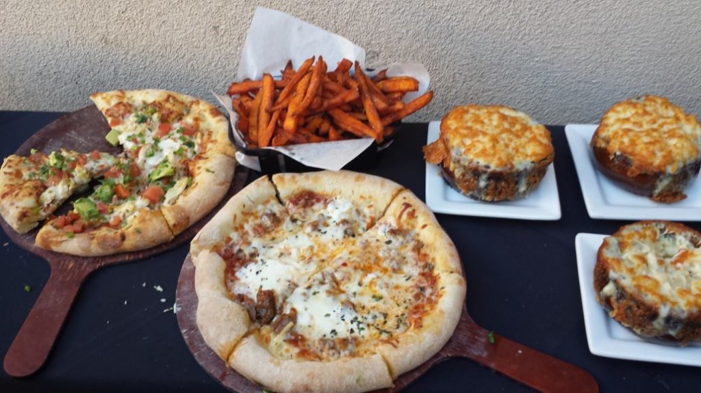 rush street food including pizza, sweet potato fries, and mac & cheese