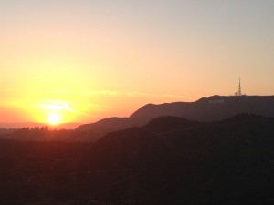sunset over hollywood hills with hollywood sign on right side