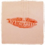 red lip print on paper