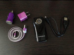 iphone charging accessories including purple car charger, wall plug, flat noodle cable, and powerbank backup battery
